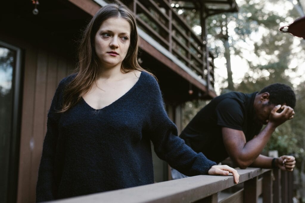 couple woman looking away man upset