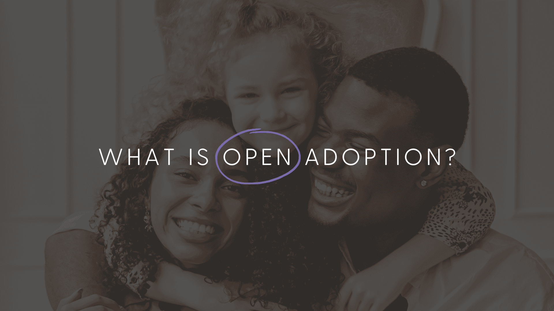 An image with 2 parents and their adopted child smiling.