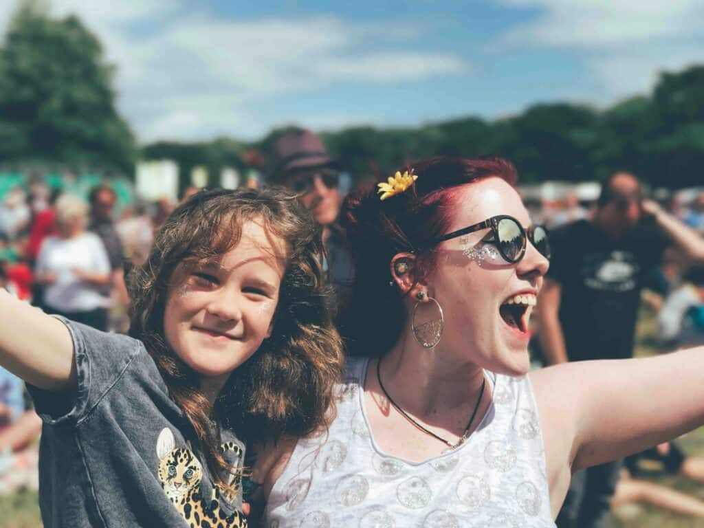Mom and daughter having fun at festival